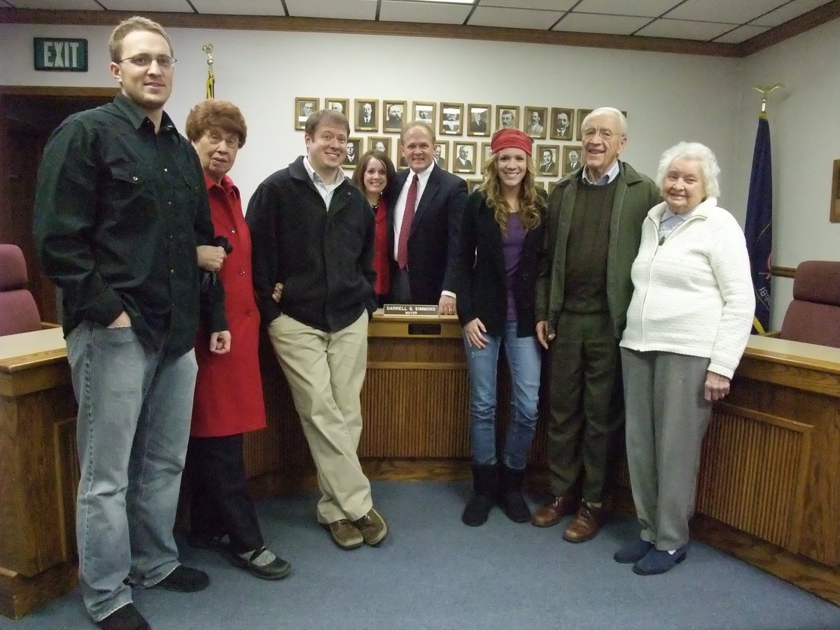 Image: Simmons family — Derek (son), Gretta (mother), Ben (son), Ruth and Darrell along with Tyra (daughter), Dale Simmons (father), and Bessie Call (mother-in-law).