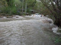 Image: Summit Creek rushes over Canyon Road near 1250 East.