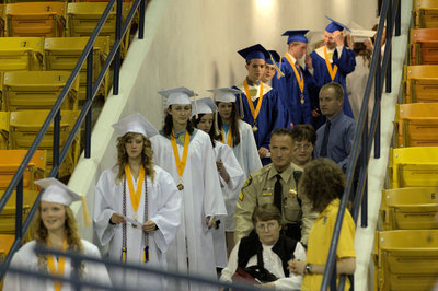 Image: Graduates line up to receive their diplomas