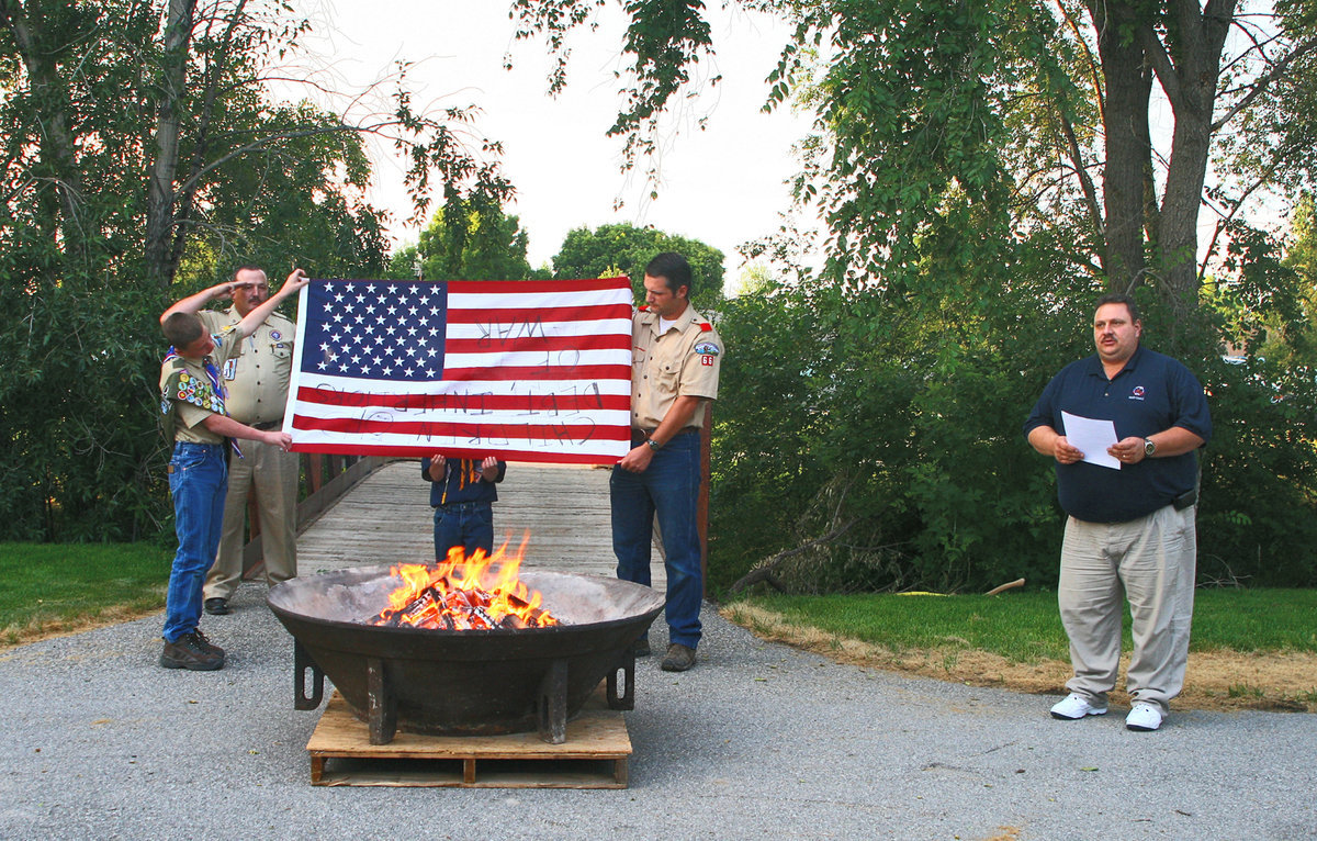 Image: Bart Baird (right) reading his thoughts on the flag.