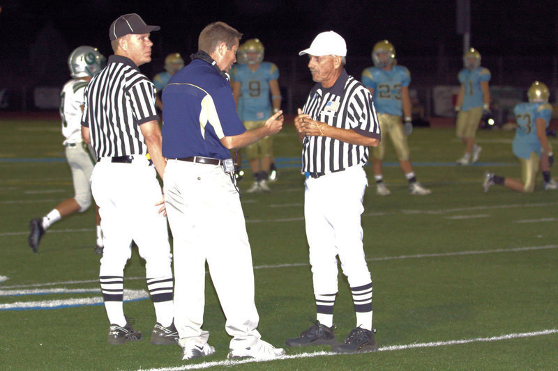 Image: Coach Anhder questioning one of the many penalty flags on the night.