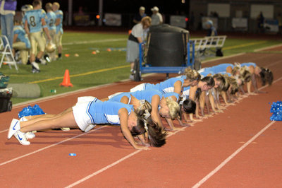 Image: Cheerleaders doing one of many sets of pushups.
