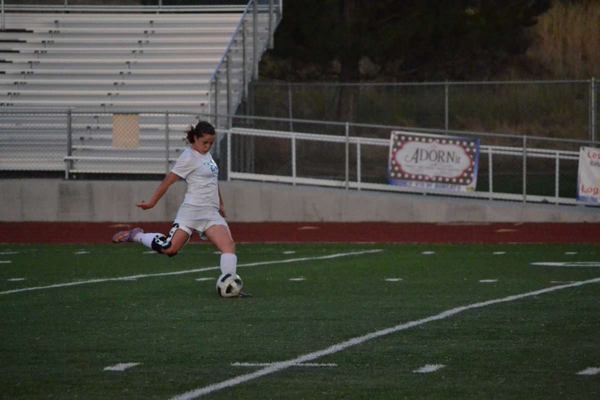 Image: Jessica Brooksby takes free kick against Roy.