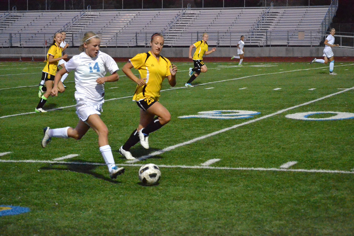 Image: Brittney Merrill races passed Roy defender.