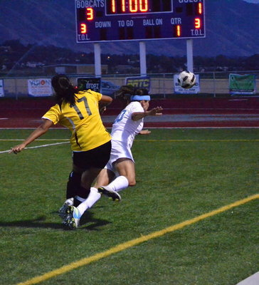 Image: Megan Hirabayashi fouls Stacy Bair receiving a yellow card on the play.