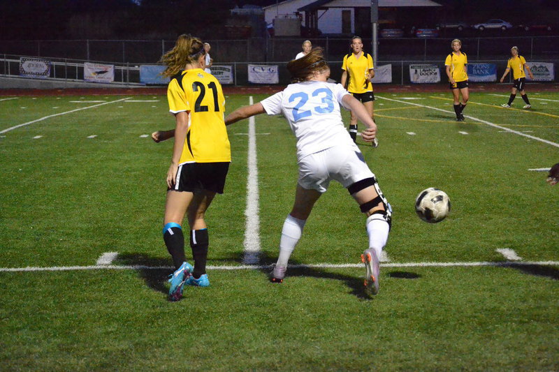 Image: Jessica Brooksby battles off Roy defender.