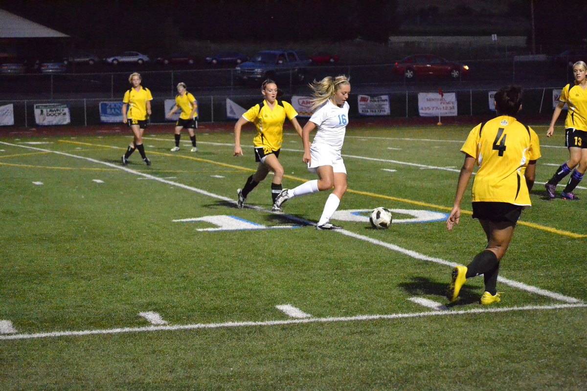 Image: McKenley Hellstern dribbles through Roy defenders.