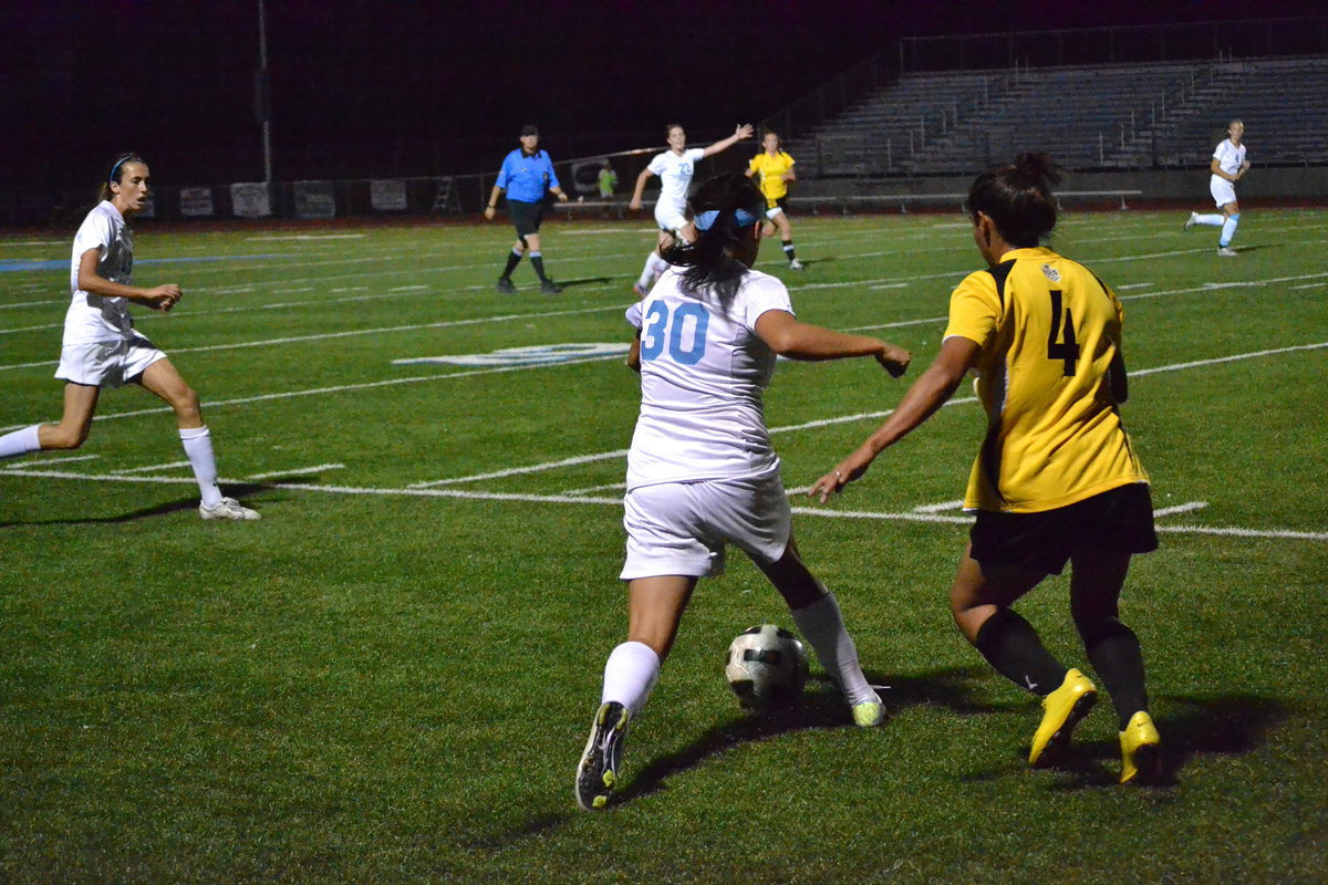 Image: Stacy Bair looking to send ball to open teammate.