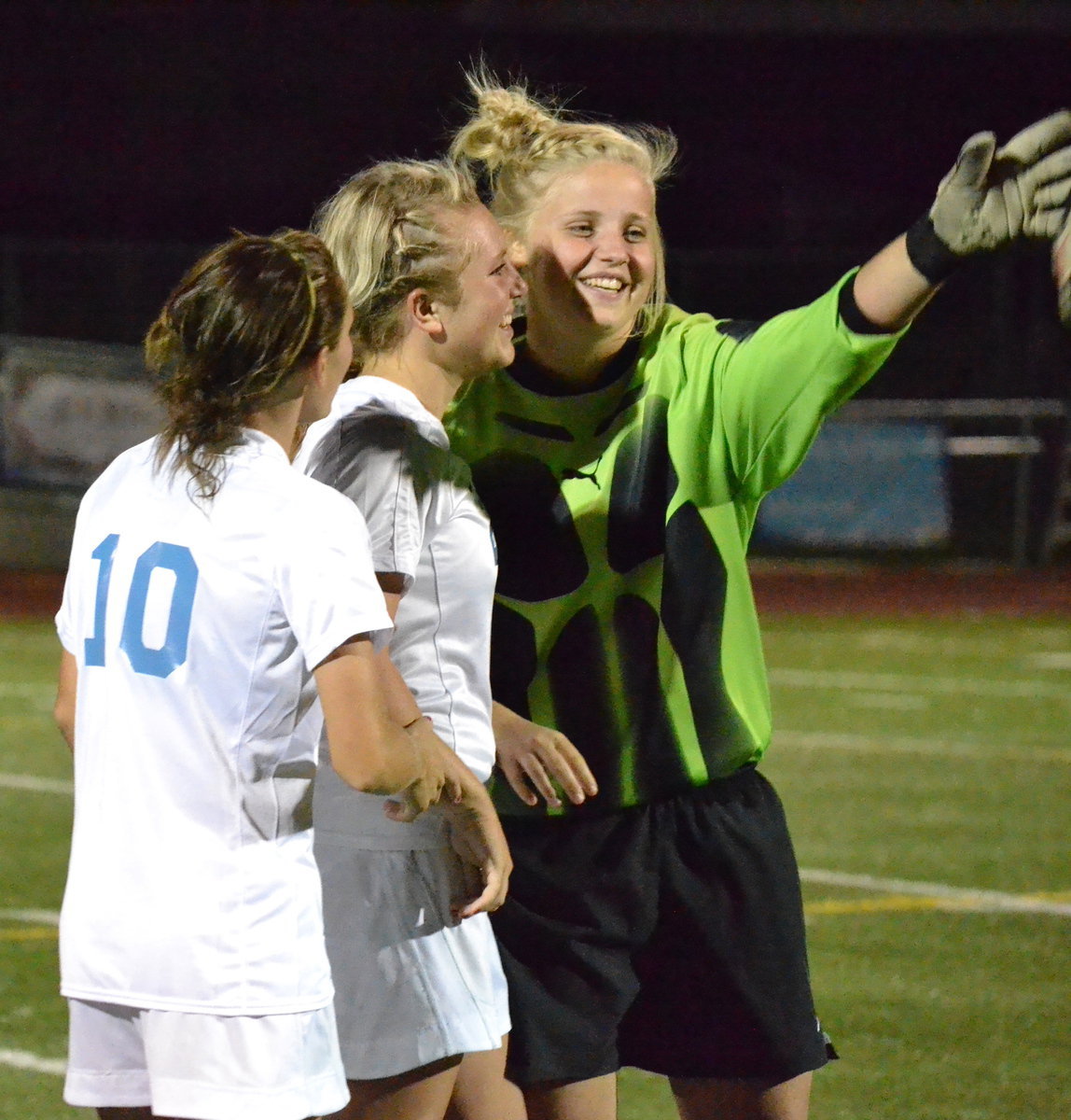 Image: Teammates celebrate after their recent win.