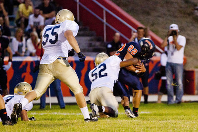 Image: Big man Tre’ Hansen (52) brings down a Bengal. Connor Chambers (55) looking to help.