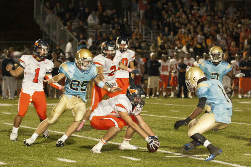 Image: Yabitse Wells and Cole Bangerter looking to get in on a Mustang fumble.
