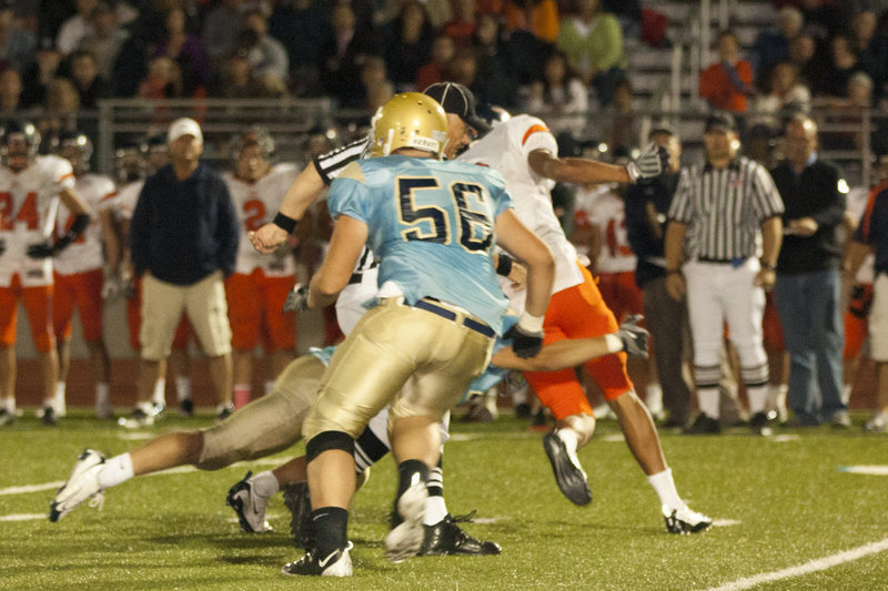 Image: Tyler Downs looks to get in on a tackle.