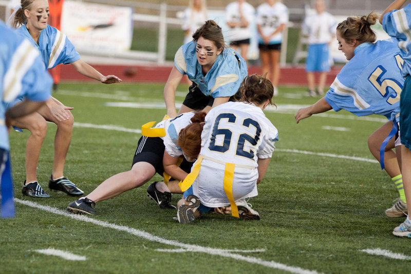 Image: Sometimes flag football gets a bit physical, as here fighting to recover a fumble.