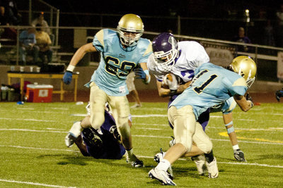 Image: Tyler Stevens and Jaden Camphouse for a tackle.