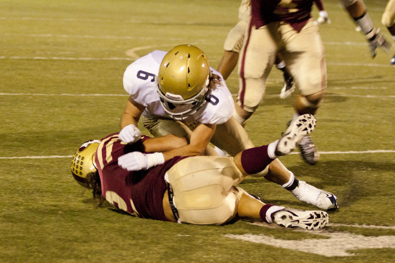 Image: Corey Jensen # 6 with a tackle
