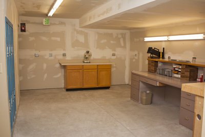 Image: Basement evidence processing room.  The basement area is all being finished by the police officers themselves.  The desks and counter top areas were salvaged from the previous city office builiding.