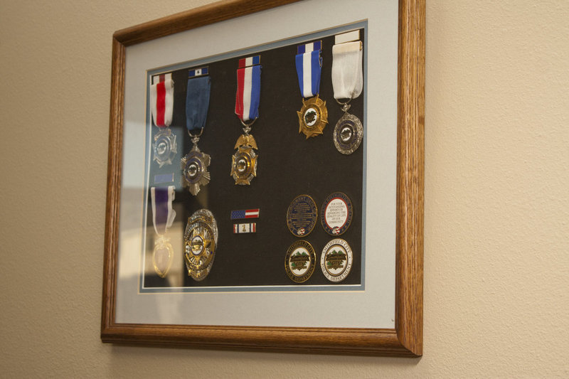 Image: Various medals on display in the front office area.
