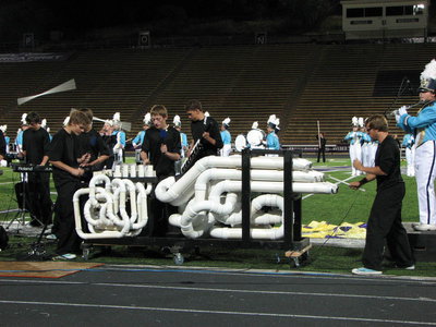 Image: Three percussionists playing the Tubulum — a hand build PVC pipe drum featured in the 2011 shows.
