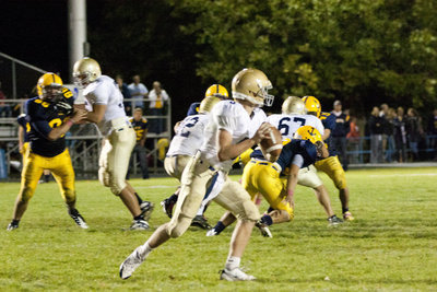 Image: Nick Carver (#8) drops back to pass.