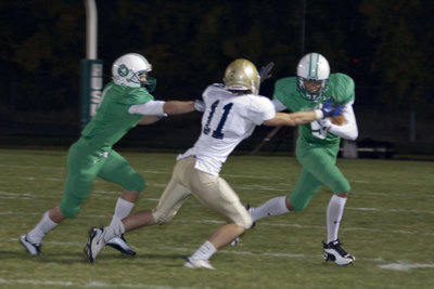 Image: Tyler Stephens (#11) stops a run play.