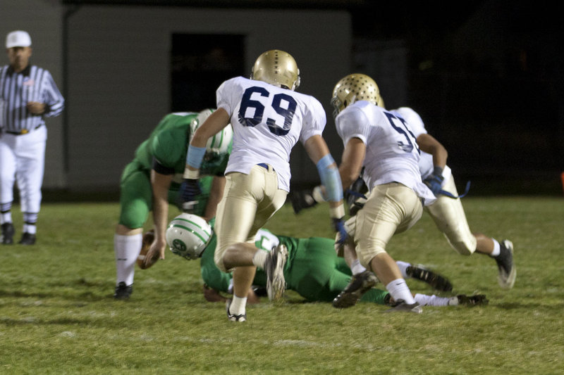 Image: Jaden Camphouse (#69) &amp; Connor Chambers (#55) close in for the kill.