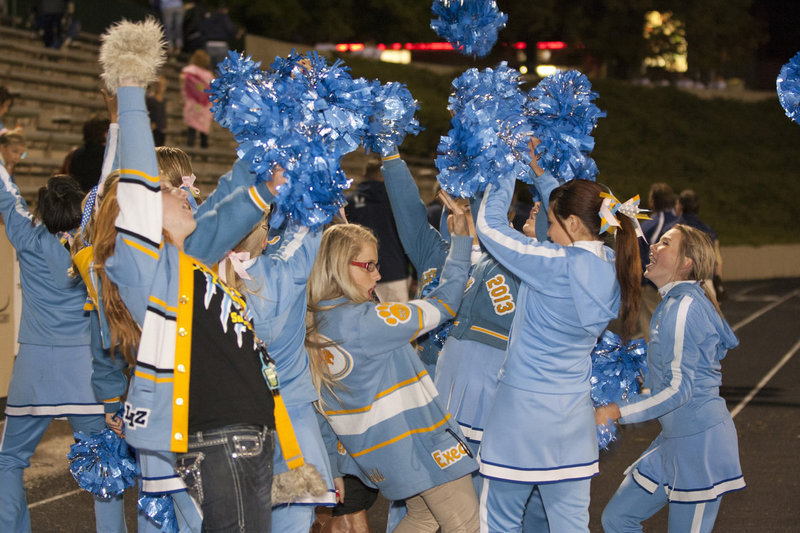 Image: The cheer squad and students celebrate the win