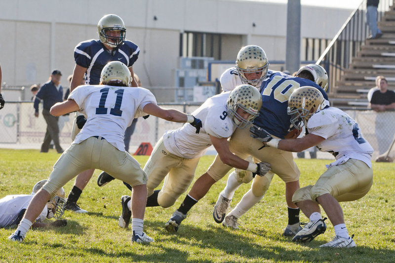 Image: Garth Jolley (#9), and Cole Bangerter (#25) team up for a tackle.