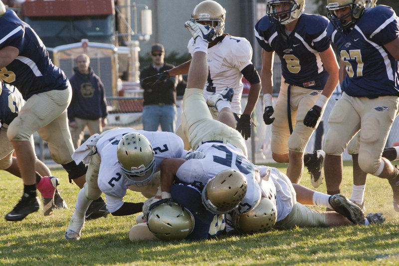 Image: Milyon Chantry (#2) and Cole Bangerter (#25) team up for a tackle.