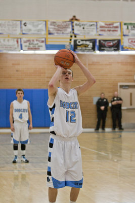 Image: Ty Nielsen shoots a pair of free throws late in the fourth quarter.