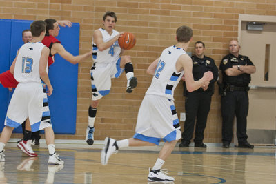 Image: Riley Knowles (4) comes down with a rebound.