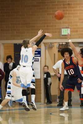 Image: Riley Knowles (10) shoots a three.